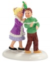 A little girl comes prepared to meet her crush, carrying a bouquet of mistletoe she bought in downtown Snow Village. She puckers up, but he's caught by surprise in this adorable figurine from Department 56.