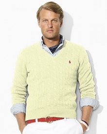 Cable-knit in luxurious tussah silk yarns for lightweight warmth, a classic-fitting V-neck sweater makes the perfect preppy layering piece. Cable-knit in luxurious tussah silk yarns for lightweight warmth, a classic-fitting V-neck sweater makes the perfect preppy layering piece.