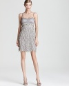 A sparkling beaded bodice tops off a skirt of dimensional petals on this party-ready Sue Wong dress.