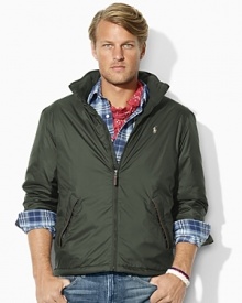 A classic-fitting lightweight windbreaker in high-performance water-resistant microfiber is equipped with a concealed zip-in hood for versatile protection. A classic-fitting lightweight windbreaker in high-performance water-resistant microfiber is equipped with a concealed zip-in hood for versatile protection.