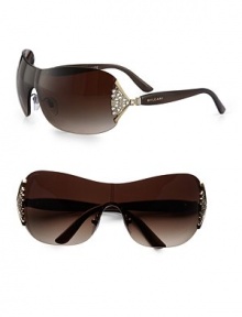 This ultra-sleek design is given a glitzy update with Austrian crystal accents. Available in brown and gold with crystal brown gradient lens.Ventaglio fan crystal temples100% UV protectionMade in Italy This ultra-sleek design is given a glitzy update with Austrian crystal accents. Available in brown and gold with crystal brown gradient lens.Ventaglio fan crystal temples100% UV protectionMade in Italy