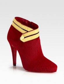 A head-turning raised silhouette of luxe pony hair, topped off with button-detailed ribbon trim. Self-covered heel, 4 (100mm)Pony hair upper with ribbon trimSide zipLeather liningSignature red leather solePadded insoleMade in Italy