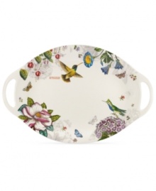 A fresh take on Portmeirion's beloved Botanic Garden pattern, the Botanic Hummingbird platter combines colorful wildlife and muted blooms on modern porcelain with integrated handles. A fresh take on Portmeirion's beloved Botanic Garden pattern, the Botanic Hummingbird platter combines colorful wildlife and muted blooms on modern porcelain with integrated handles.