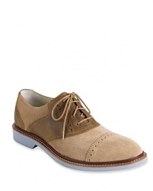 With a contrast upper and bright pops of color, this stepped-up saddle shoe from Cole Haan features concealed NIKE AIR technology for maximum comfort. With a contrast upper and bright pops of color, this stepped-up saddle shoe from Cole Haan features concealed NIKE AIR technology for maximum comfort.