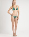 Bold animal print meets a classic swim silhouette featuring chain-link enhanced straps. Halter strap ties at neckBack tie closure84% polyamide/16% elastaneFully linedHand washImported Please note: Bikini bottom sold separately. 