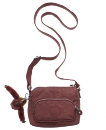 Kipling's Tedros crossbody purse shows off your sporty side, in durable, modern 420 denier nylon. Kipling's Tedros crossbody purse shows off your sporty side, in durable, modern 420 denier nylon.