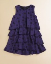 A fun tiered design with sparkly, allover eyelet adding a hint of shine.Round neckline Sleeveless Multiple ruffled tiers Back keyhole button closure Cotton lining 62% cotton/38% silk Machine wash or dry clean Imported