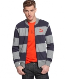 Sporty bar stripes elevate this Puma jacket from workout gear to street style. Sporty bar stripes elevate this Puma jacket from workout gear to street style.