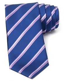 A perfect balance of classic and modern, with a handsome and traditional stripe pattern crafted with an on-trend skinny width, this tie transitions seamlessly from work to a downtown art opening or dinner with clients. A perfect balance of classic and modern, with a handsome and traditional stripe pattern crafted with an on-trend skinny width, this tie transitions seamlessly from work to a downtown art opening or dinner with clients.