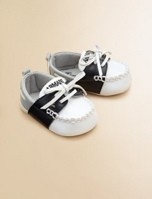 An adorable pair of colorblock, faux-tie mocassins will keep little feet stylish and cozy.Slip-on with faux-tiePolyurethane upperCotton lining75% polyurethane/25% rubber soleImported An adorable pair of colorblock, faux-tie mocassins will keep little feet stylish and cozy.Slip-on with faux-tiePolyurethane upperCotton lining75% polyurethane/25% rubber soleImported