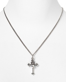 Introduce a Left Coast attitude into your jewelry box with Queen Baby's sterling silver pendant. Slip the traditionally styled silver cross over feminine tops and dresses for a hit of meaningful sparkle.