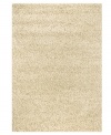 Throw it in neutral. This natural-toned area rug by Couristan is created by blending different thicknesses of soft wool yarn, blissfully plush with an ultra-thick pile that's rich in both texture and tone.