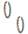 Traditional hoop earrings with an earthy look and feel. Lucky Brand's hippie-chic style combines oval-cut reconstituted turquoise stones in a silver tone mixed metal setting. Approximate diameter: 1-5/8 inches.