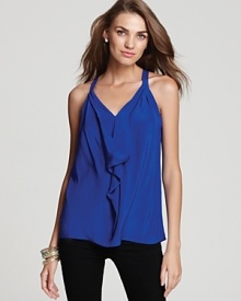 A breezy racerback top, rendered in pure silk, with an elegant drape front keeps them intrigued from entrance to exit.