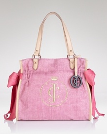 Take a textured vacation from your staid day bag and opt for Juicy Couture's metallic linen tote. With bold pink bows, this carryall hits the tarmac and hints at your girlie side. Take a textured vacation from your staid day bag and opt for Juicy Couture's metallic linen tote. With bold pink bows, this carryall hits the tarmac and hints at your girlie side.