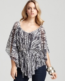 A bohemian Sweet Pea wrap top flaunts kimono sleeves and an artful print for a unique look that pairs with minimalist separates for an inspired workweek.