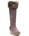 Fight the freeze in elevated style with these quilted wedge boots, accented with soft faux fur. By GUESS.