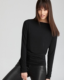 Ultra soft and super sleek, this perfectly fitted Vince boat-neck tee is a wardrobe essential. Ultra soft and super sleek, this perfectly fitted Vince boat-neck tee is a wardrobe essential.