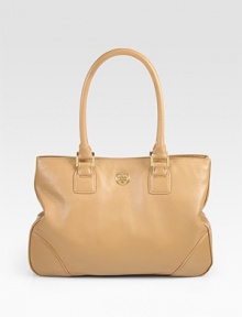 A clean design of luxe pebble-grain leather, with a signature goldtone emblem and side snaps for a cinched shape. Double top handles, 7½ dropMagnetic snap closureSide snapsProtective metal feetOne inner zip compartmentOne inside zip pocketTwo inside open pocketsCanvas lining13W X 9½H X 4DImported A clean design of luxe pebble-grain leather, with a signature goldtone emblem and side snaps for a cinched shape. Double top handles, 7½ dropMagnetic snap closureSide snapsProtective metal feetOne inner zip compartmentOne inside zip pocketTwo inside open pocketsCanvas lining13W X 9½H X 4DImported