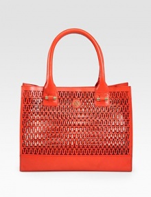 Chic logo cut-outs lend a signature touch to this roomy vachetta leather carryall.Double top handles, 7 dropTop snap closureProtective metal feet13¾W X 10¾H X 3¼DImported Chic logo cut-outs lend a signature touch to this roomy vachetta leather carryall.Double top handles, 7 dropTop snap closureProtective metal feet13¾W X 10¾H X 3¼DImported