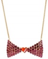 Tie it, you'll love it. This necklace from Betsey Johnson is crafted from gold-tone mixed metal with a bow pendant adorned with fuchsia glass crystal accents and a heart in the center. Approximate length: 16 inches + 3-inch extender. Approximate drop: 2 inches.