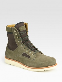 Lace-up leather high top design highlights two-toned paneling in suede and cotton canvas with a comfortable, contrasting Vibram sole.Suede/cotton upperLeather liningPadded insoleVibram soleImported