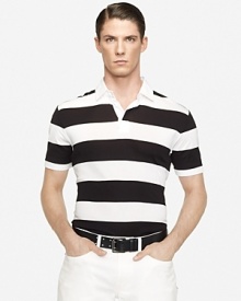 Cut in a trim, contemporary silhouette, a striped short-sleeved rugby shirt embodies modern athleticism in fine-ribbed cotton that's mercerized for a handsome luster. Cut in a trim, contemporary silhouette, a striped short-sleeved rugby shirt embodies modern athleticism in fine-ribbed cotton that's mercerized for a handsome luster.
