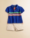 Rendered in lightweight, breathable cotton mesh, this classic polo design features a bold stripe at the chest.Ribbed polo collarShort sleevesFront button placketUneven vented hemCottonMachine washImported Please note: number of buttons may vary depending on size ordered. 