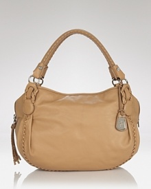 Cole Haan's signature satchel is dressed up in leather with whipstich detailing. Pockets and over-the-shoulder ease make this style ideal for the woman with day-to-night demands. Cole Haan's signature satchel is dressed up in leather with whipstich detailing. Pockets and over-the-shoulder ease make this style ideal for the woman with day-to-night demands.
