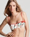 Make a sweet and splashy statement in Juicy Couture's cherry-print top. In a vintage-inspired shape, this bikini top brings a playfulness to your pool side arsenal.