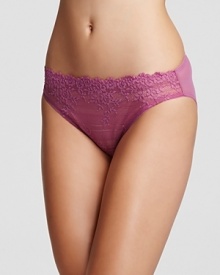 A sultry bikini with a floral lace front and sheer mesh back. A sultry bikini with a floral lace front and sheer mesh back.