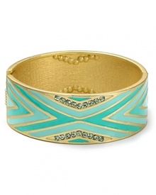 Aqua's gold and enamel hinge bangle is a bold way to celebrate exotic glamour. Wear it solo or wear it with similar styles to put a eclectic spin on every look.