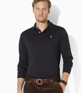 Designed for a comfortable fit with a wider body and longer hem, this long-sleeved polo shirt is crafted in a dense interlock stitch with supple suede accents for a smooth, refined look.