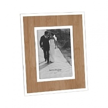 A faux bamboo insert provides the perfect backdrop, with silver accents for a natural yet eye-catching frame. A faux bamboo insert provides the perfect backdrop, with silver accents for a natural yet eye-catching frame.