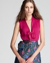 Exude ladylike chic in this luxe silk Rachel Zoe top finished with a playful bow.