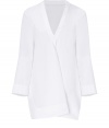 With modern-minimalist detailing and a contemporary cut, Jil Sanders pristine white cotton tunic is an effortless chic choice - V-neckline with folded front detail, long sleeves, cut-out slit sides, longer back - Loose fit - Wear over slim-fit separates with sleek leather flats