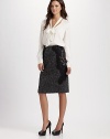 A classic pencil silouhette, rendered in alternating panels of tweed and animal print, and trimmed in swaths of lace.Fitted silhouetteLace trimBack zipStretch satin liningAbout 25½ from natural waist70% wool/30% nylonDry cleanImported of Italian fabric