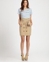 The classic trench is reinvented as a trendy, tailored pencil skirt.Belted waistButton frontAngled flap side pockets with buttonsBack ventAbout 21 from natural waistCottonDry cleanImported Model shown is 5'10 (177cm) wearing US size 4.