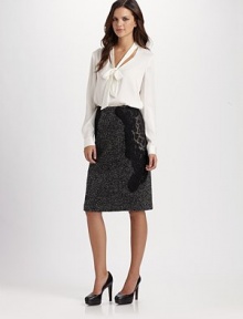 A classic pencil silouhette, rendered in alternating panels of tweed and animal print, and trimmed in swaths of lace.Fitted silhouetteLace trimBack zipStretch satin liningAbout 25½ from natural waist70% wool/30% nylonDry cleanImported of Italian fabric A classic pencil silouhette, rendered in alternating panels of tweed and animal print, and trimmed in swaths of lace.Fitted silhouetteLace trimBack zipStretch satin liningAbout 25½ from natural waist70% wool/30% nylonDry cleanImported of Italian fabric