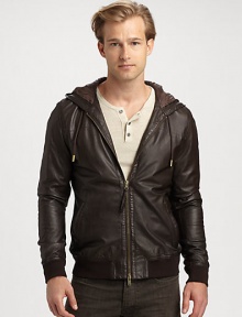 A rich leather jacket with a two-way zip front, is a definite wardrobe essential, while an attached hood lends a contemporary edge that is both rugged and refined.Two-way zip frontAttached drawstring hoodWaist slash pocketsBanded cuffs and hemAbout 26 from shoulder to hemLeatherDry cleanImported A rich leather jacket with a two-way zip front, is a definite wardrobe essential, while an attached hood lends a contemporary edge that is both rugged and refined.Two-way zip frontAttached drawstring hoodWaist slash pocketsBanded cuffs and hemAbout 26 from shoulder to hemLeatherDry cleanImported