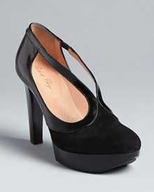 Robert Clergerie is a master at creating high-fashion styles that are still walkable; these elegant platform pumps deliver, day and night. Robert Clergerie is a master at creating high-fashion styles that are still walkable; these elegant platform pumps deliver, day and night.