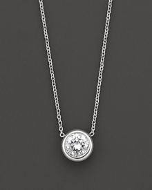 White gold bezel-set diamond solitaire necklace. With signature ruby accent. Designed by Roberto Coin. White gold bezel-set diamond solitaire necklace. With signature ruby accent. Designed by Roberto Coin.