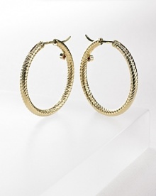 18K yellow gold hoop earrings with signature ruby accent from Roberto Coin. 18K yellow gold hoop earrings with signature ruby accent from Roberto Coin.
