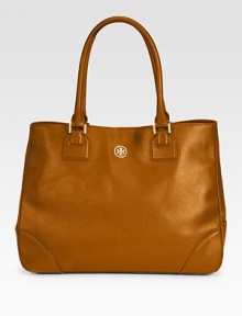 Simple, clean and classic, this roomy leather style features double top handles, side snaps, and a goldtone logo emblem on the front.Double top handles, 8 drop Magnetic snap closure Protective metal feet Two inside zip pockets Two inside open pockets Cotton lining 15½W X 12H X 5D Imported