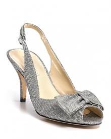 Glittery fabric lends sparkling glamour to Enzo Angiolini's Roxas slingbacks, effortlessly assisting your impending grand entrance. Glittery fabric lends sparkling glamour to Enzo Angiolini's Roxas slingbacks, effortlessly assisting your impending grand entrance.