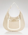 Designed to go uptown, downtown, and everywhere in between, this Tory Burch hobo epitomizes Manhattan cool. Crafted of canvas with leather trims, it's such a city pretty.