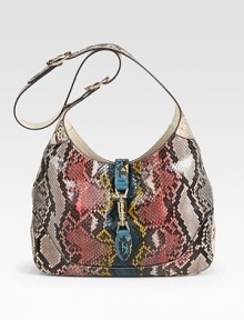 Python skin defines this roomy carryall.Adjustable and detachable shoulder strap, 8¾-19¾ dropPiston clasp closureOne inside zip pocketOne cell phone pocketOne PDA pocketLeather lining13W X 9H X 2¾DMade in Italy Python skin defines this roomy carryall.Adjustable and detachable shoulder strap, 8¾-19¾ dropPiston clasp closureOne inside zip pocketOne cell phone pocketOne PDA pocketLeather lining13W X 9H X 2¾DMade in Italy