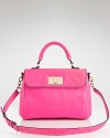 Poppy pink hues are big news for spring. This chic leather satchel from kate spade new york is a practical and perfectly poised way to work the trend.
