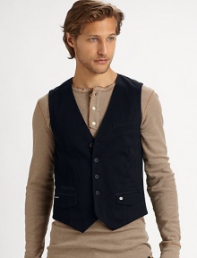 A well-tailored vest is tailored in triple twisted cotton twill to add instant polish to your everyday ensembles.Button frontWaist flap pocketsCottonDry cleanImported