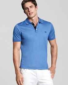 This unparalleled Salvatore Ferragamo polo in a sleek fit boasts a contrasting placket and an ultra-sleek fit for all-season style. This unparalleled Salvatore Ferragamo polo in a sleek fit boasts a contrasting placket and an ultra-sleek fit for all-season style.